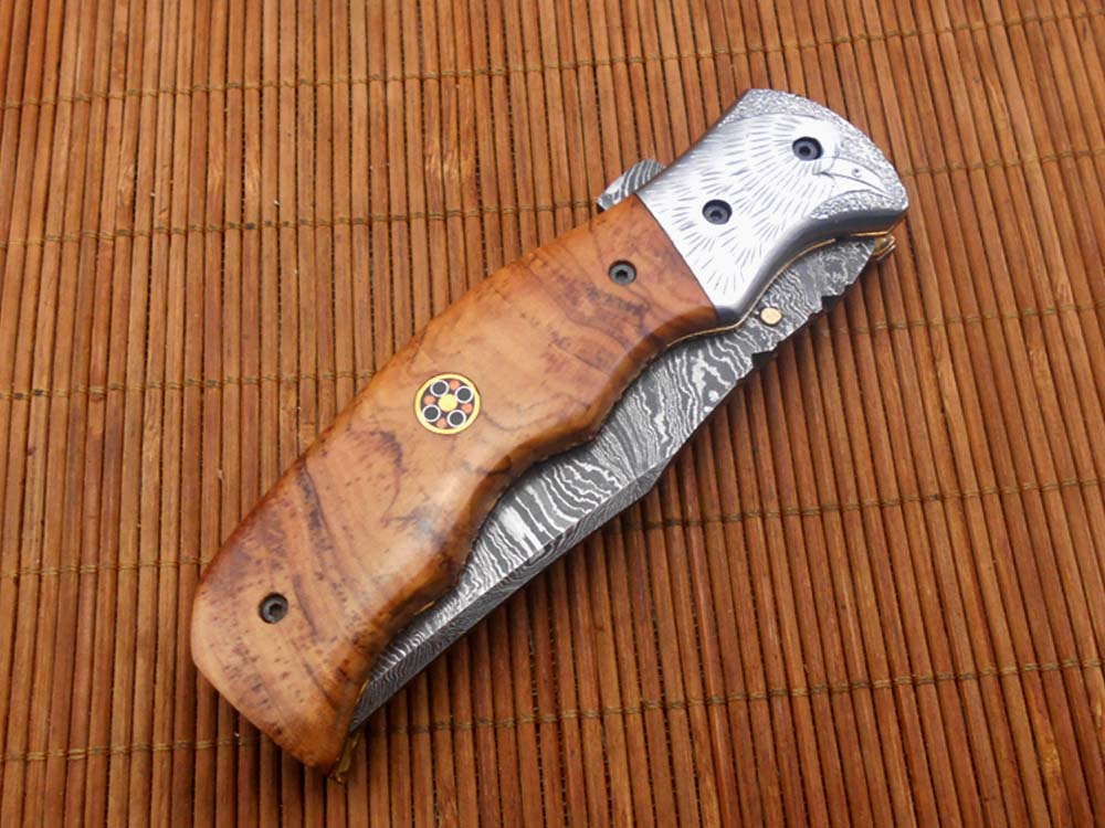 Folding knife Tracker blade knife with Engraved bird on steel bolster, 8" Hand forged Damascus steel, Available in 3 scales, Equipped with Brass Liner lock, Cow hide Leather sheath with belt loop