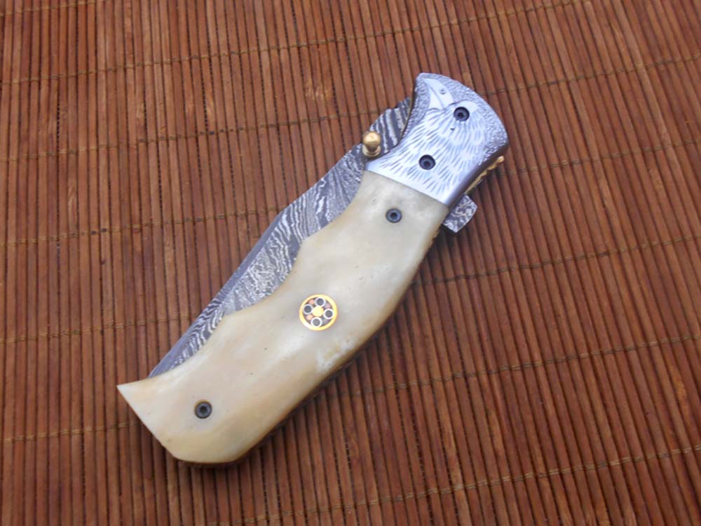 Folding knife Tracker blade knife with Engraved bird on steel bolster, 8" Hand forged Damascus steel, Available in 3 scales, Equipped with Brass Liner lock, Cow hide Leather sheath with belt loop