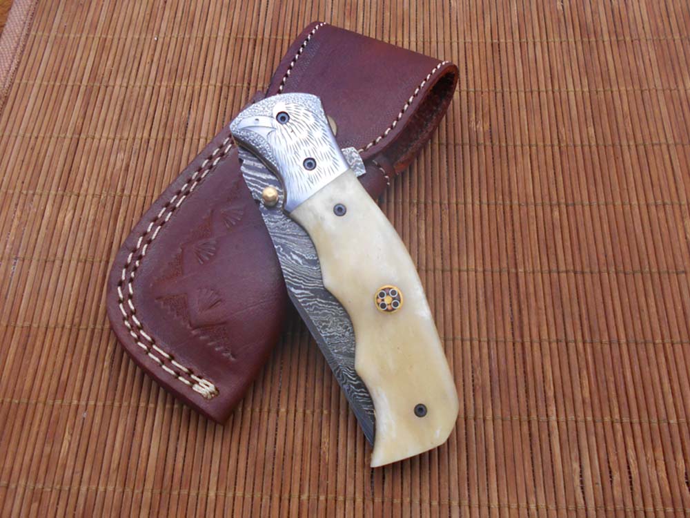 Folding knife Tracker blade knife with Engraved bird on steel bolster, 8" Hand forged Damascus steel, Available in 3 scales, Equipped with Brass Liner lock, Cow hide Leather sheath with belt loop