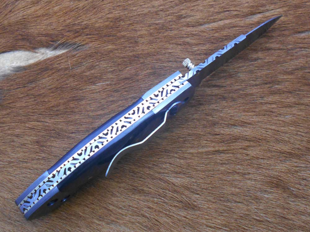 7.5" Damascus folding knife with Damascus bolster on both edges with thumb knob & liner lock equipped, Available in 4 scales, Cow hide leather sheath with belt loop included