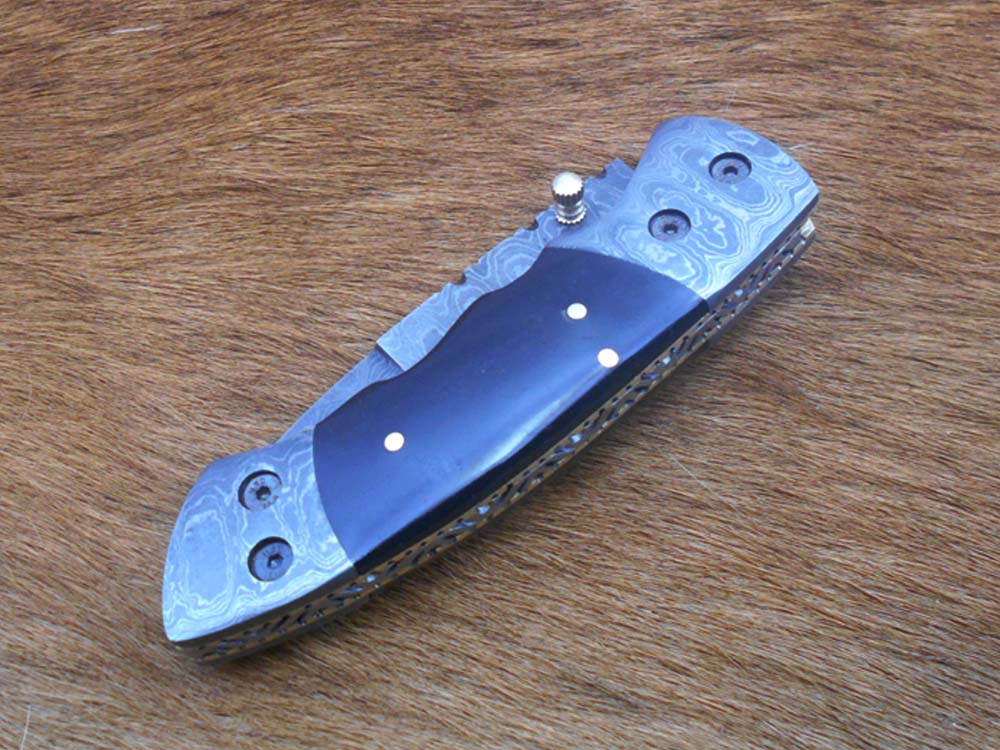 7.5" Damascus folding knife with Damascus bolster on both edges with thumb knob & liner lock equipped, Available in 4 scales, Cow hide leather sheath with belt loop included