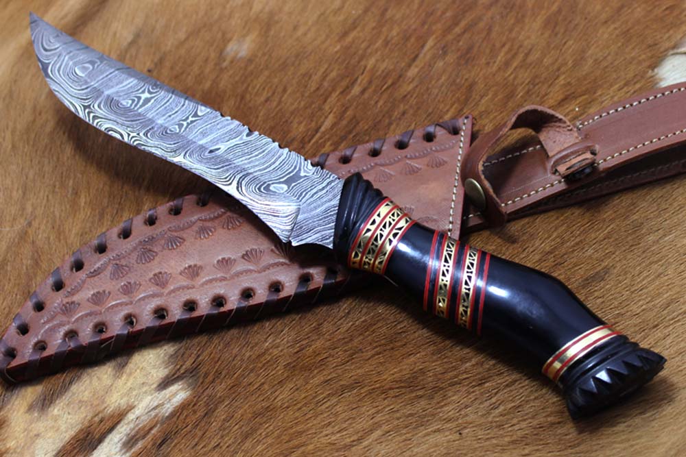 13" Long hand forged Damascus steel skinning knife, Hand carved scale crafted with engraved brass spacer, Available in Camel bone, Walnut wood and bull horn scales, Includes Cow Leather sheath