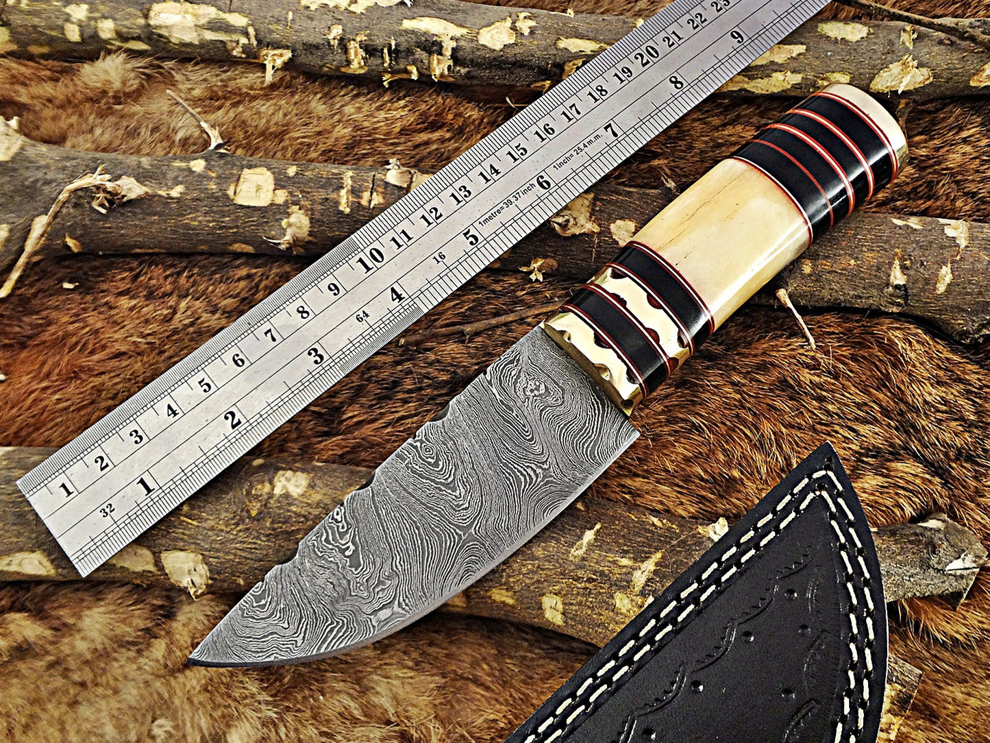 9" Long hand forged Damascus steel Knife, Buffalo Horn round scale with engraved Brass and fiber spacing, cow hide Leather sheath