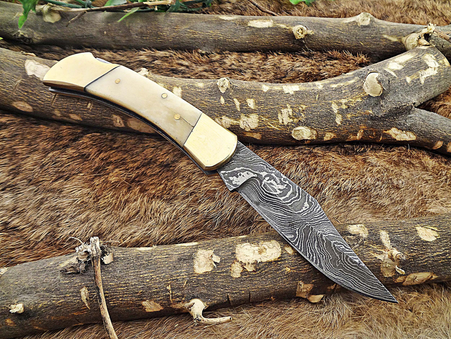 7.5" back liver lock Folding Knife, Hand forged Damascus steel blade, Available in wood, Bone and Horn scales bolster, Comes with cow hide leather sheath