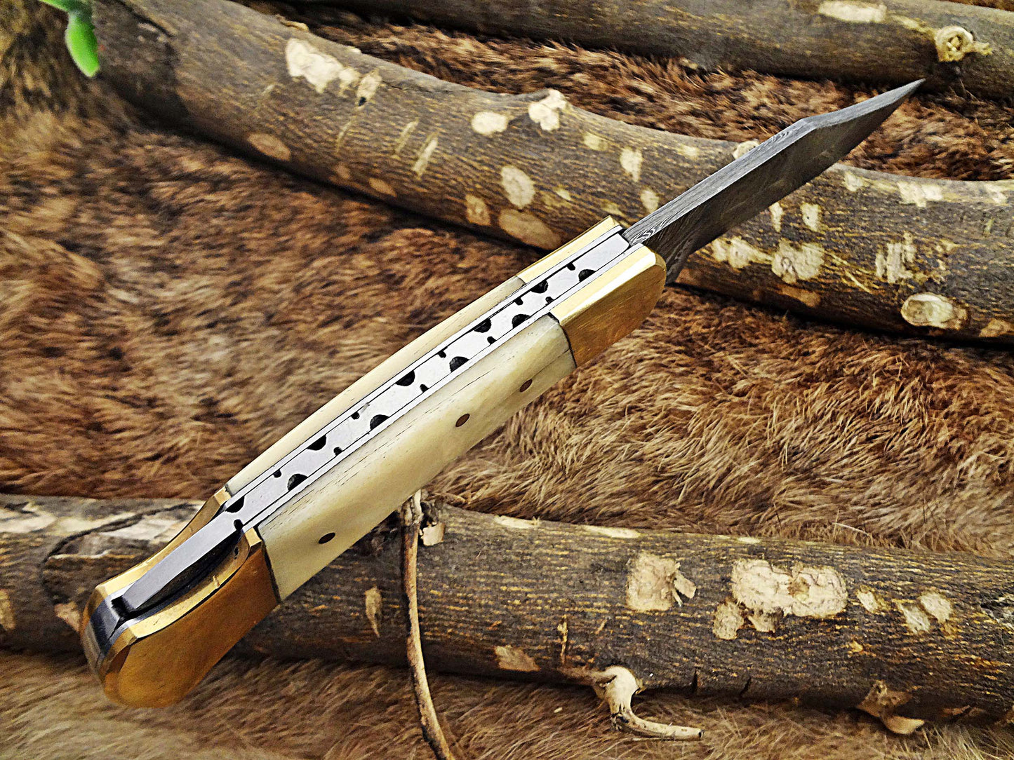 7.5" back liver lock Folding Knife, Hand forged Damascus steel blade, Available in wood, Bone and Horn scales bolster, Comes with cow hide leather sheath