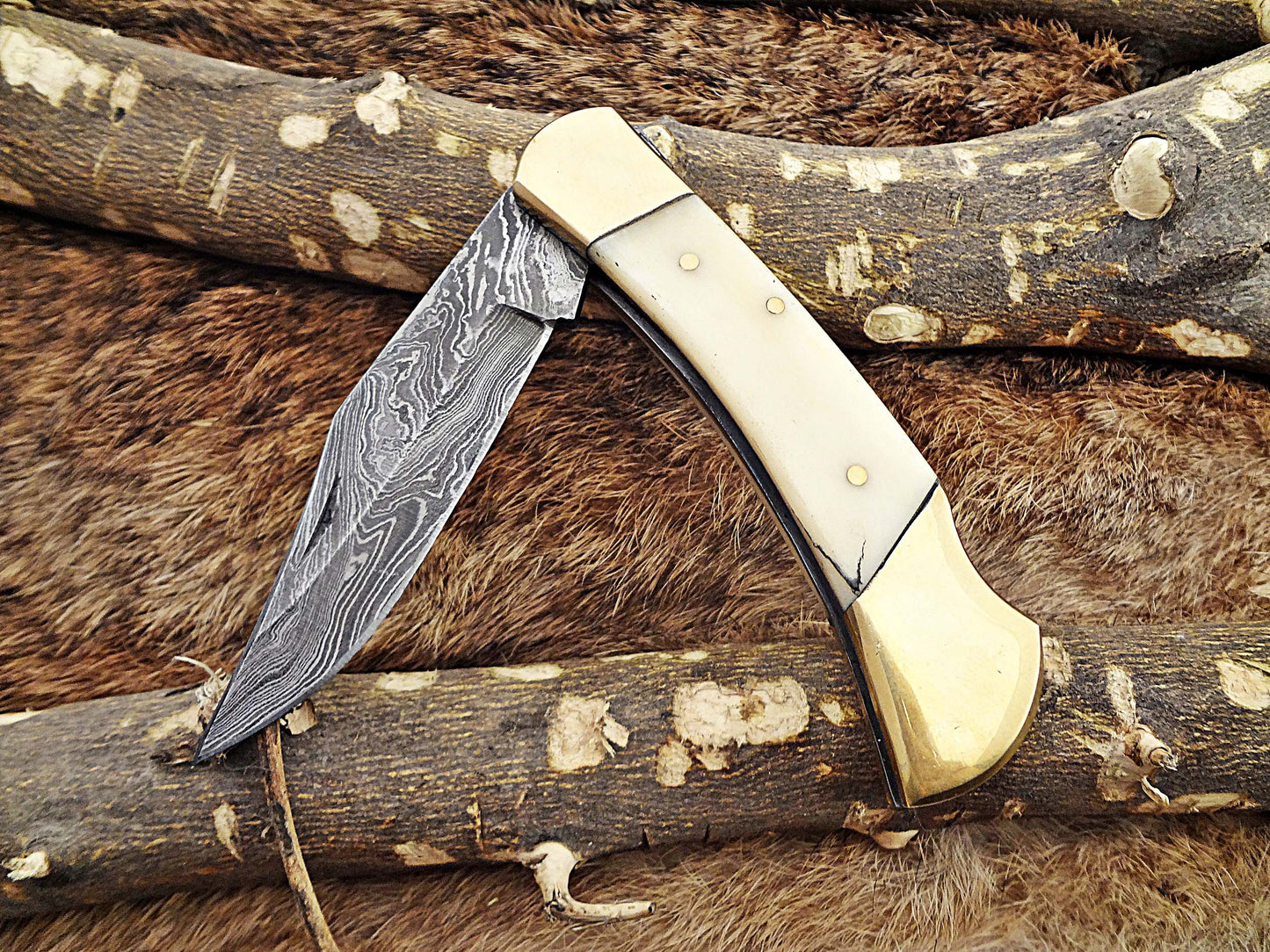 7.5" back liver lock Folding Knife, Hand forged Damascus steel blade, Available in wood, Bone and Horn scales bolster, Comes with cow hide leather sheath