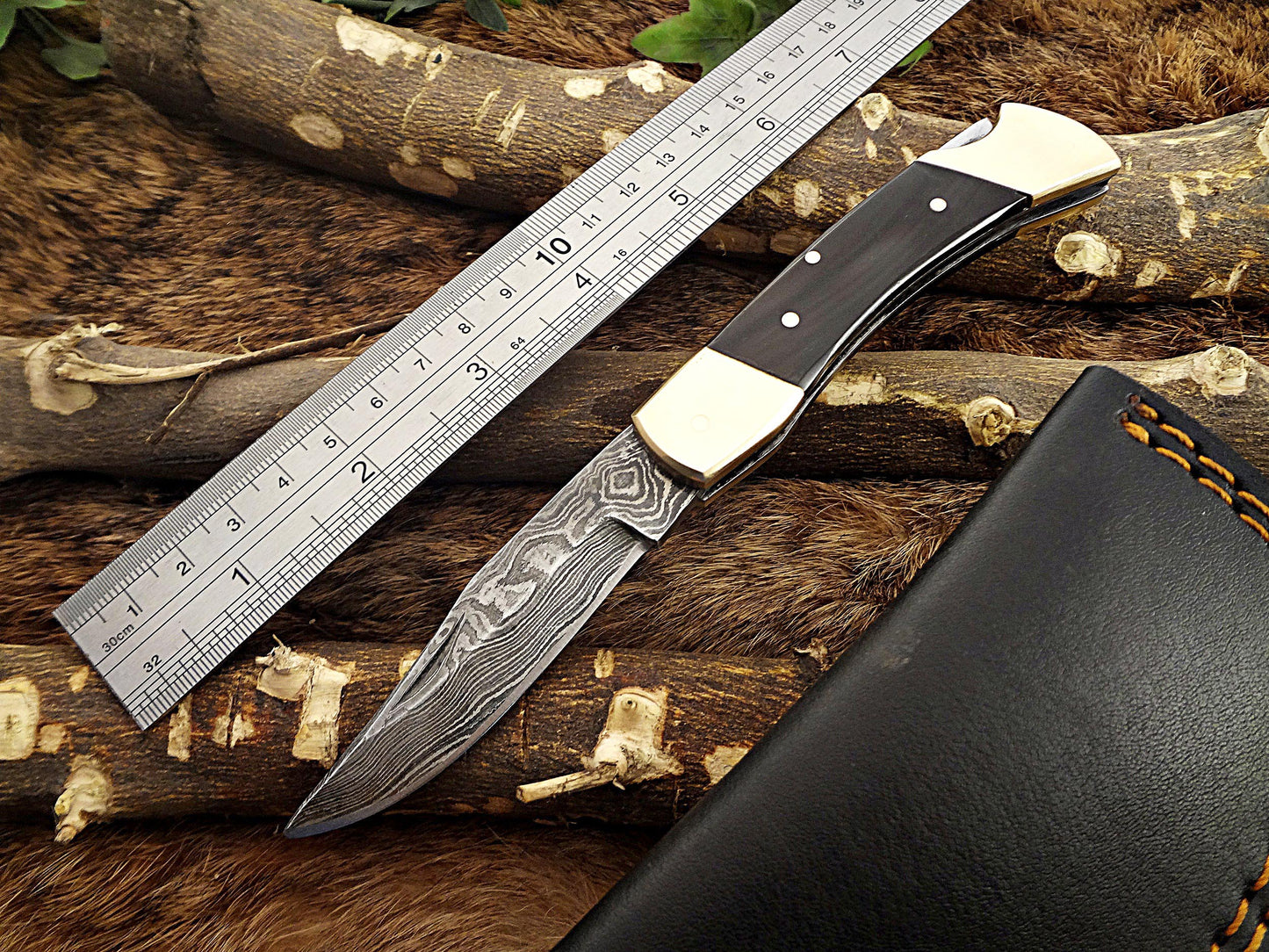 7.5" back liver lock Folding Knife, Hand forged Damascus steel blade, Available in wood, Bone and Horn scales bolster, Comes with cow hide leather sheath