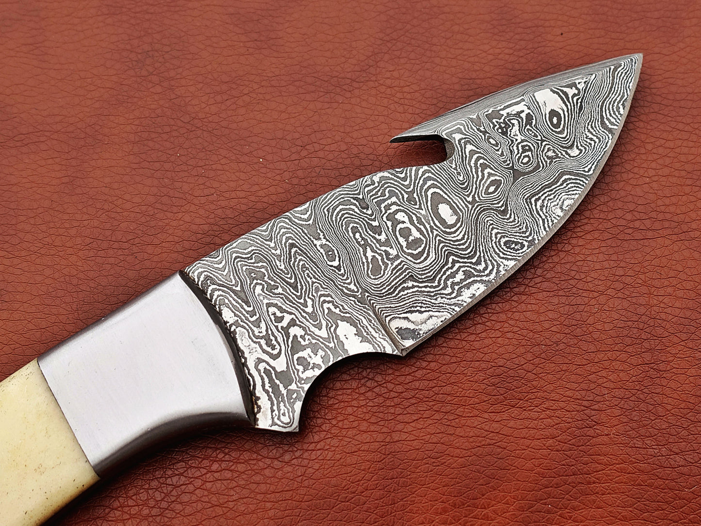 9.5" long Damascus steel Gut hook skinning knife, Full tang Rain drop pattern blade, available in 4 colors, includes Cow hide Leather sheath