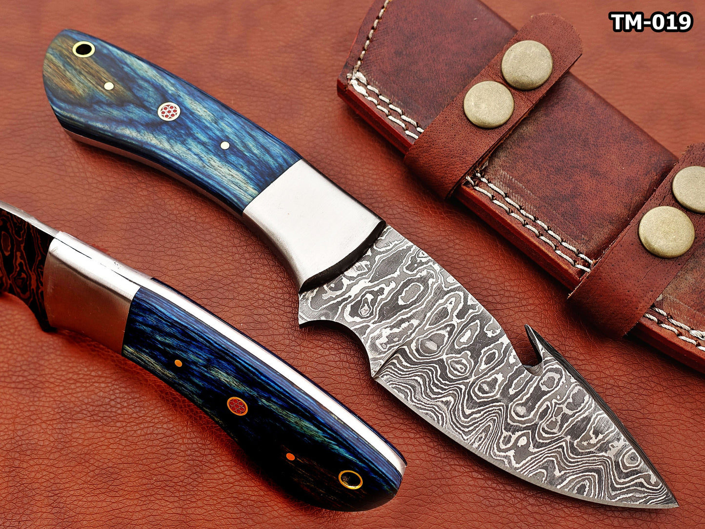 9.5" long Damascus steel Gut hook skinning knife, Full tang Rain drop pattern blade, available in 4 colors, includes Cow hide Leather sheath