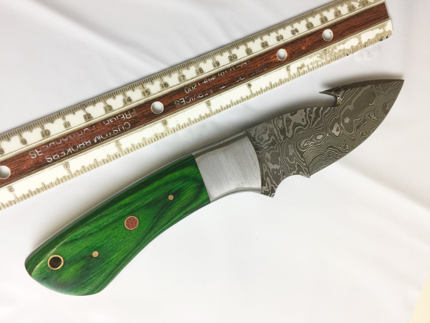 9.5" long Damascus steel Gut hook skinning knife, Full tang Rain drop pattern blade, available in 4 colors, includes Cow hide Leather sheath