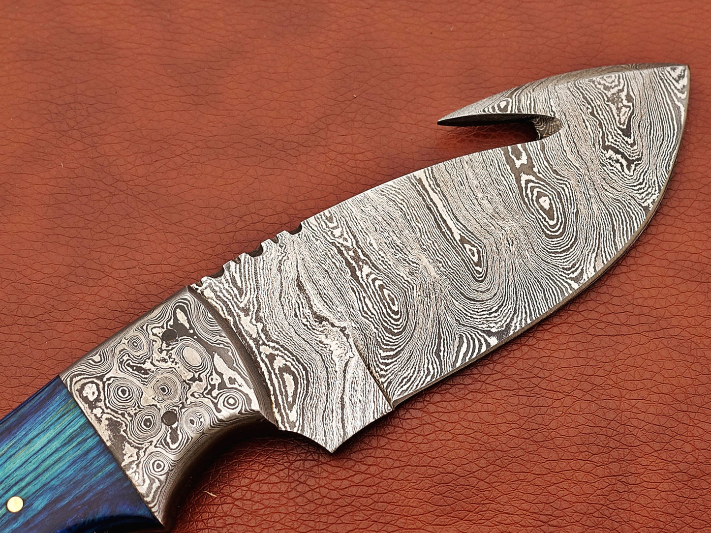 9.5" long Damascus steel Rain drop pattern Gut hook skinning knife, Full tang blade available in 4 colors, includes Cow hide Leather sheath