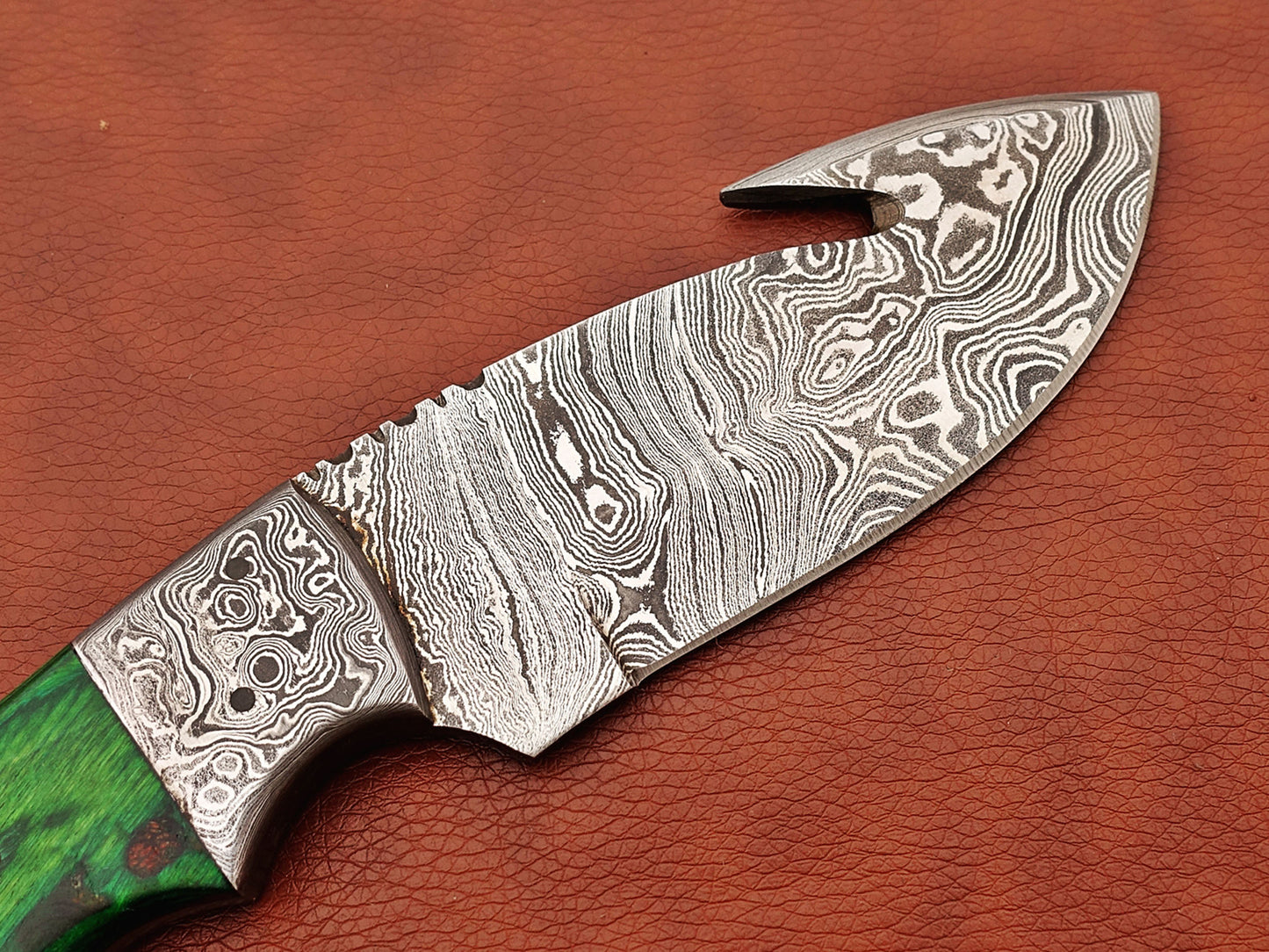 9.5" long Damascus steel Rain drop pattern Gut hook skinning knife, Full tang blade available in 4 colors, includes Cow hide Leather sheath
