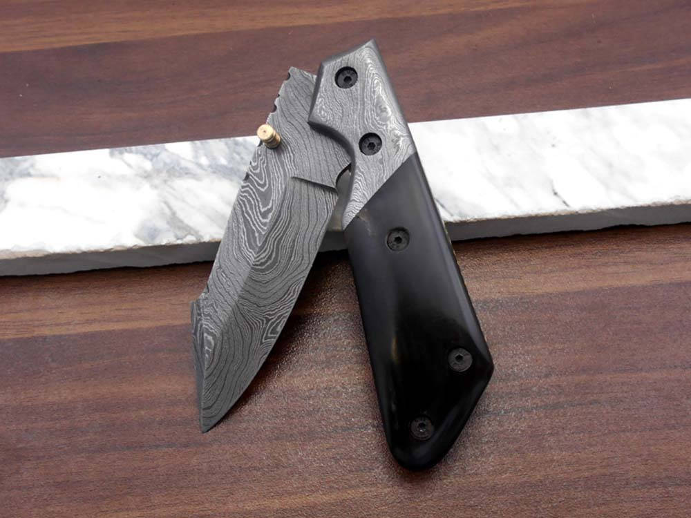 Damascus steel 7.5" long Folding Knife Bull horn with Damascus bolster pocket clip scale, custom made Hand Forged blade cow leather sheath