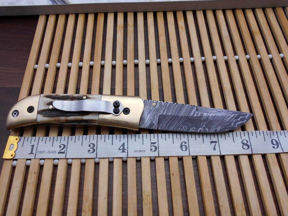 Stag antler scale Hand Forged Damascus steel 8.2" long Folding Knife with pocket clip,Brass bolster, thumb knob, cow hide leather sheath