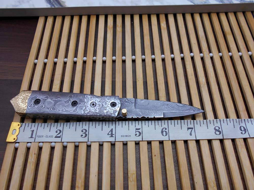 Damascus steel 7.5" long Folding Knife Damascus with engraved brass & steel scale, custom made 3" Hand Forged blade cow hide leather sheath
