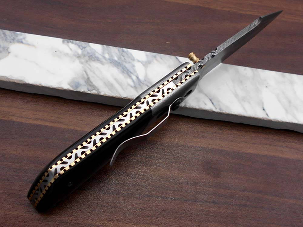 Damascus steel 7.5" long Folding Knife Bull horn with Damascus bolster pocket clip scale, custom made Hand Forged blade cow leather sheath