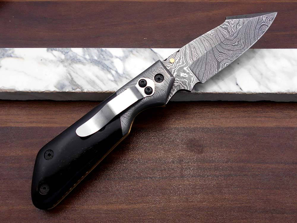 Damascus steel 7.5" long Folding Knife Bull horn with Damascus bolster pocket clip scale, custom made Hand Forged blade cow leather sheath