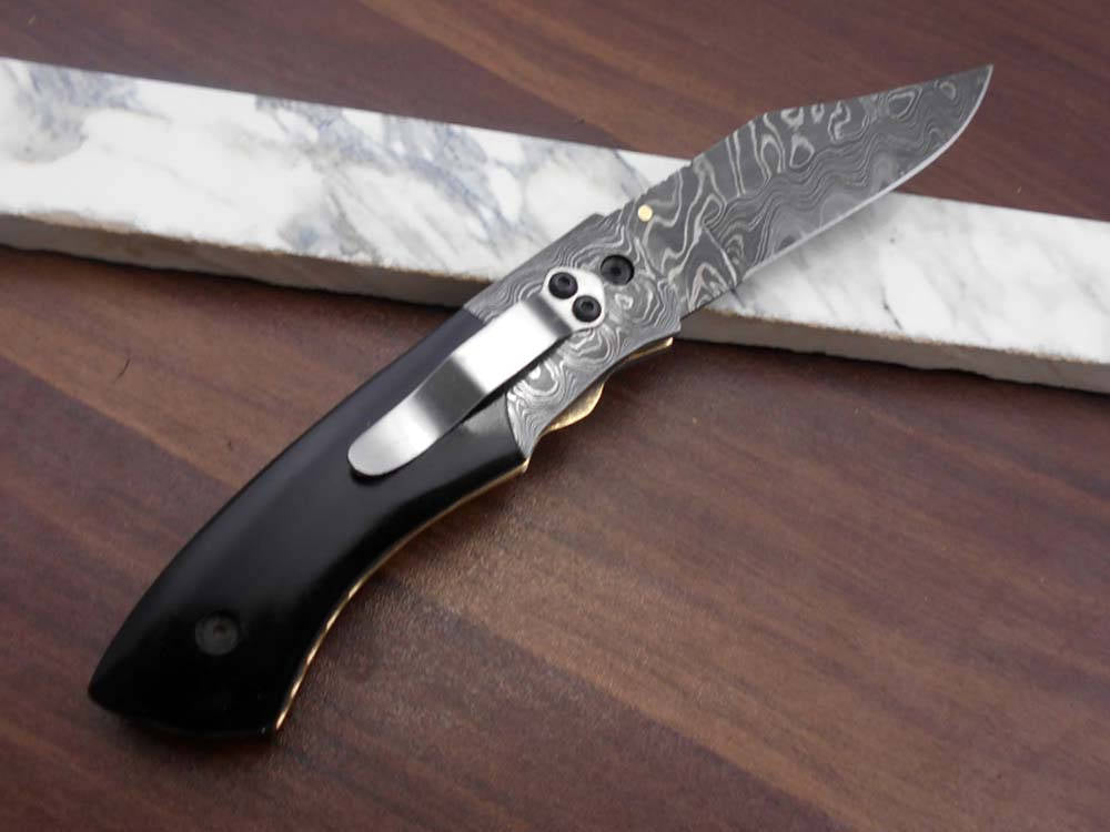 8.5" long hand forged custom made Damascus steel pocket clip folding knife, available in 4 scales options with Damascus Bolster, Comes with Cow hide leather sheath