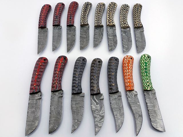 30 pieces Damascus steel fixed blade skinning knives lot with Leather sheath. Over 225 inches long Damascus steel knives in assorted colors