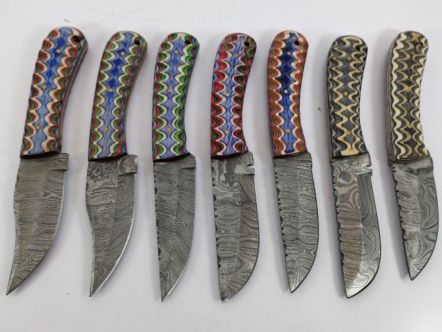 15 pieces Damascus steel Multi color jigged scale skinning knives set with Leather sheath. Over 110 inches long Damascus steel blade knives