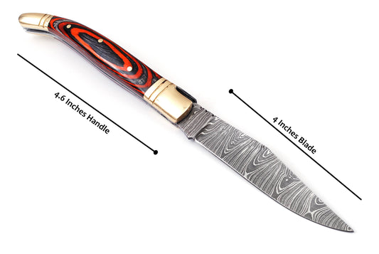 Folding Damascus steel knife, 8.5" Long with 4" hand forged custom twist pattern Blade. Orange & Black wood scale with brass bolster, Cow hide leather sheath included