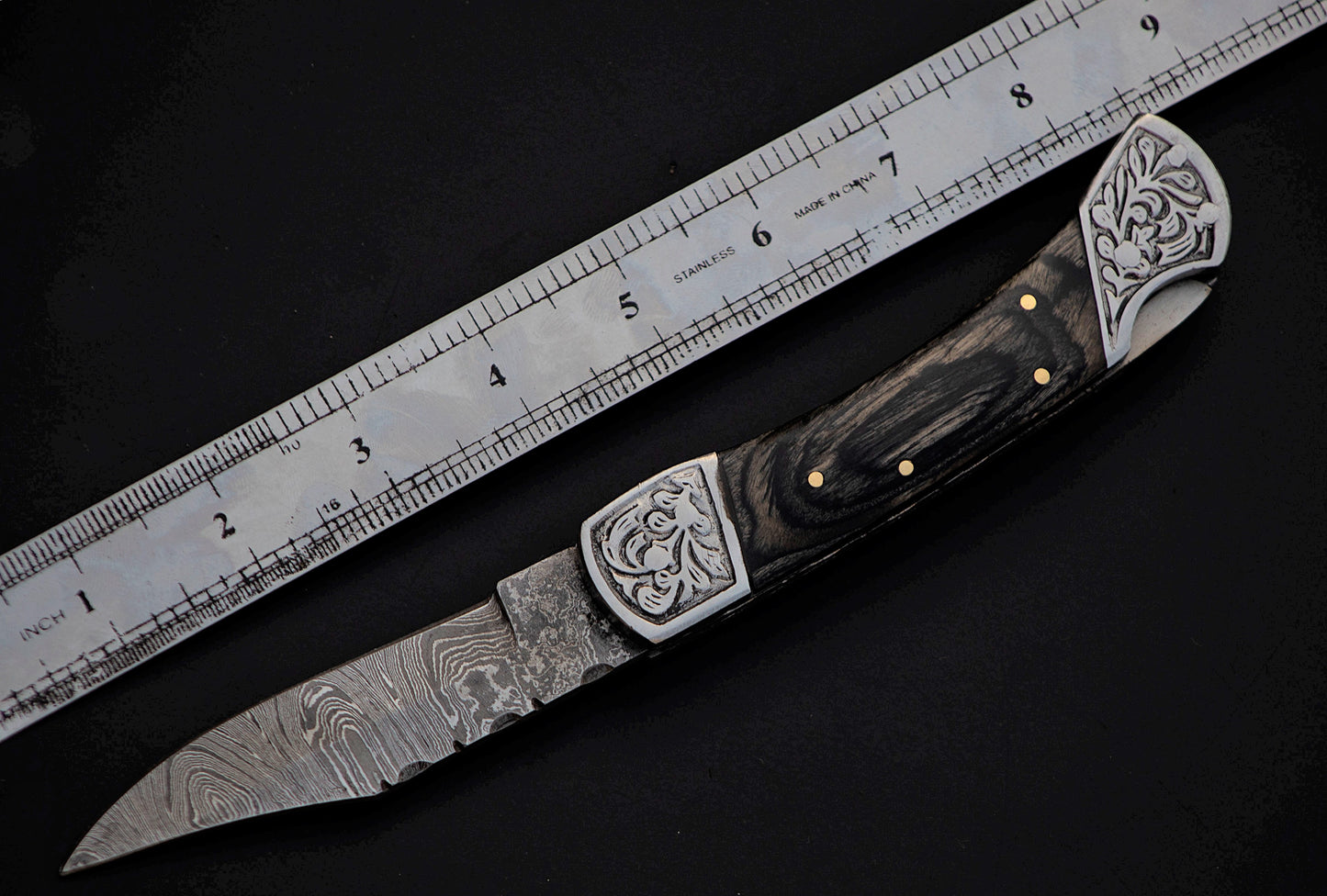 9" long back lock Folding Knife, Black wood Scale with Engraved steel bolster, custom made 4" Hand Forged Damascus steel blade, Cow hide leather sheath with belt loop