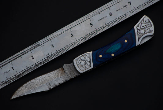 7" long back lock Folding Knife, Blue wood Scale with Engraved steel bolster, custom made 3.25" Hand Forged Damascus steel blade, Cow hide leather sheath with belt loop