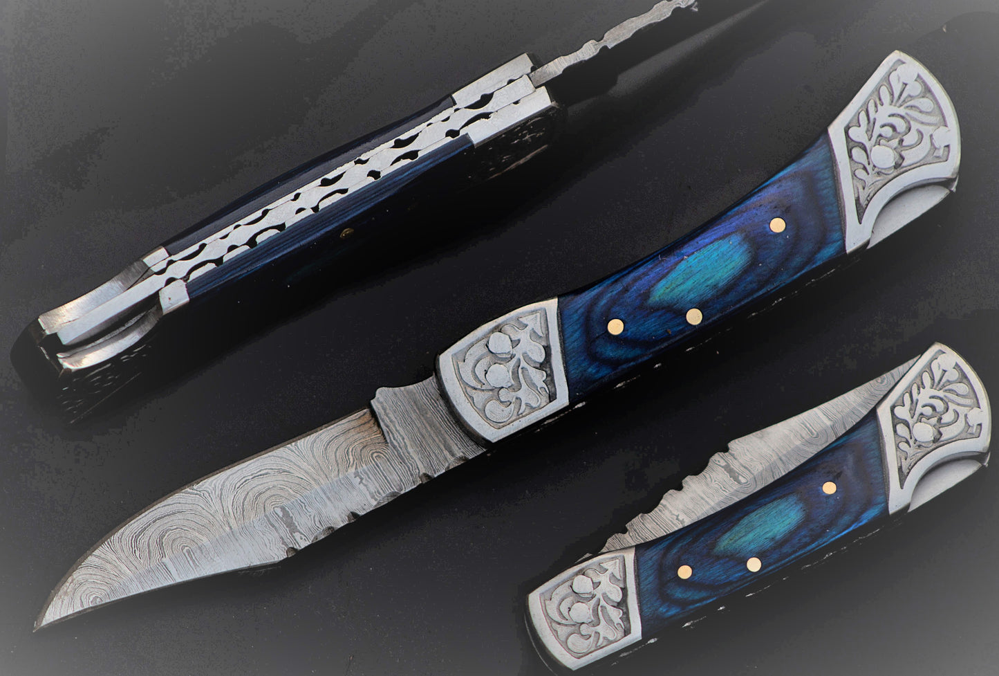 7" long back lock Folding Knife, Blue wood Scale with Engraved steel bolster, custom made 3.25" Hand Forged Damascus steel blade, Cow hide leather sheath with belt loop