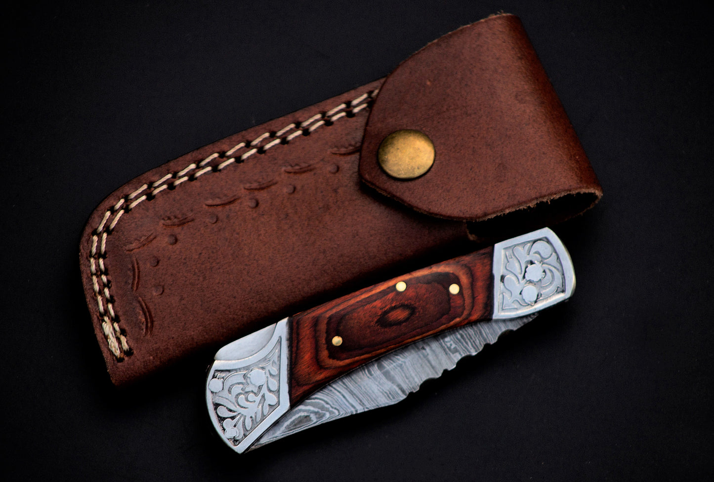 7" long back lock Folding Knife, Rose wood Scale with Engraved steel bolster, custom made 3.25" Hand Forged Damascus steel blade, Cow hide leather sheath with belt loop
