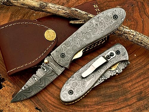 7.5" long Full Damascus steel scale and blade custom made Folding Knife with pocket clip and liner lock to keep blade opened while using, Ladder pattern blade and Rain drop pattern Damascus steel scale, cow hide leather sheath included