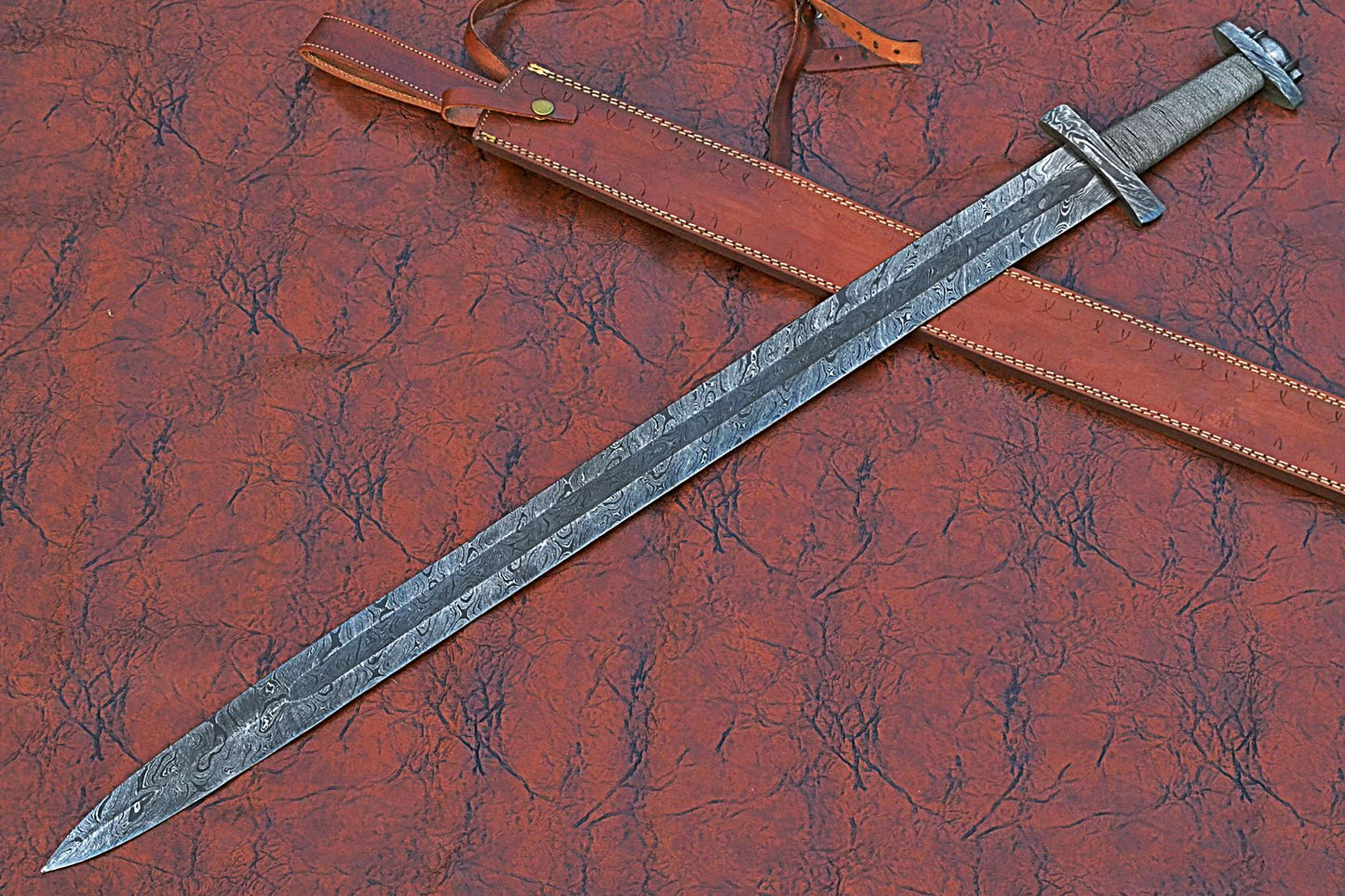 38 inches long Gladius sword, 31" long Hand forged Damascus steel double edge blade, Solid Damascus steel cross guard and pommel, Matching color thread wrap grip, Leather scabbard with shoulder stripe
