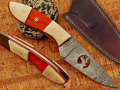 9" Long drop point Damascus steel blade skinning knife, Deer graphic wire cut blade, Red wood scale with White Bone installed over wood scale, hand forged Twist pattern Damascus steel full tang blade, Includes cow hide Leather sheath