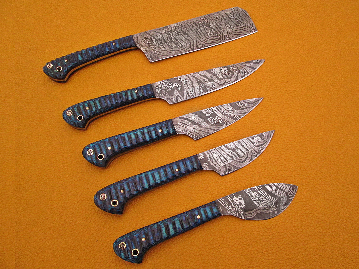 5 Pieces Damascus steel kitchen knife set includes (10.6+9.6+9.0+8.0+7.6)" knives in Blue Jigged wood scale, includes Roll able Leather suede sheath