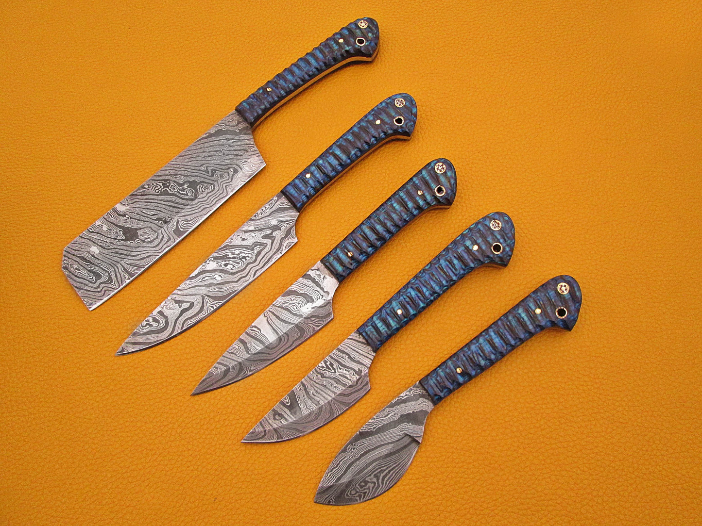 5 Pieces Damascus steel kitchen knife set includes (10.6+9.6+9.0+8.0+7.6)" knives in Blue Jigged wood scale, includes Roll able Leather suede sheath