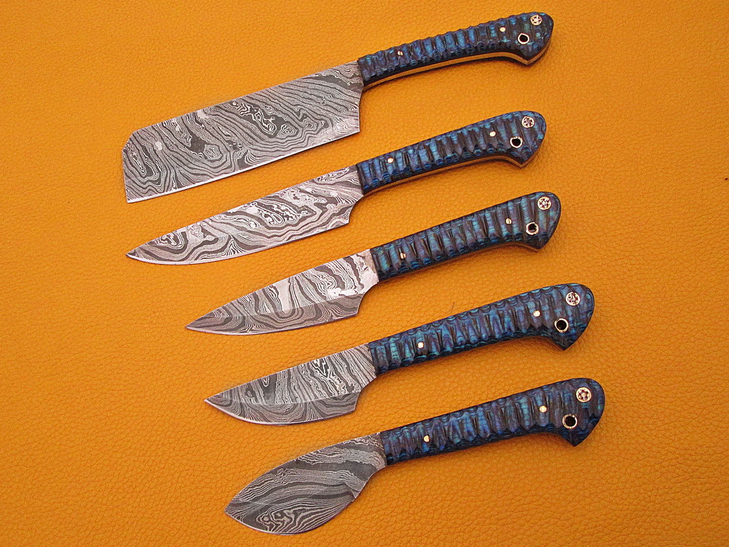 5 Pieces Damascus steel kitchen knife set includes (10.6+9.6+9.0+8.0+7.6)" knives in Blue Jigged wood scale, includes Roll able Leather suede sheath