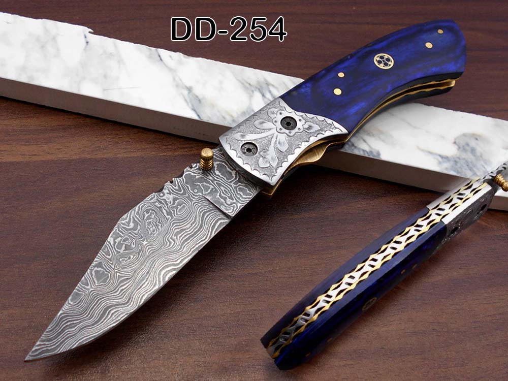 8" long hand forged custom made Damascus steel pocket clip folding knife, Blue Colored wood scale with engraved steel Bolster, Cow hide leather sheath included