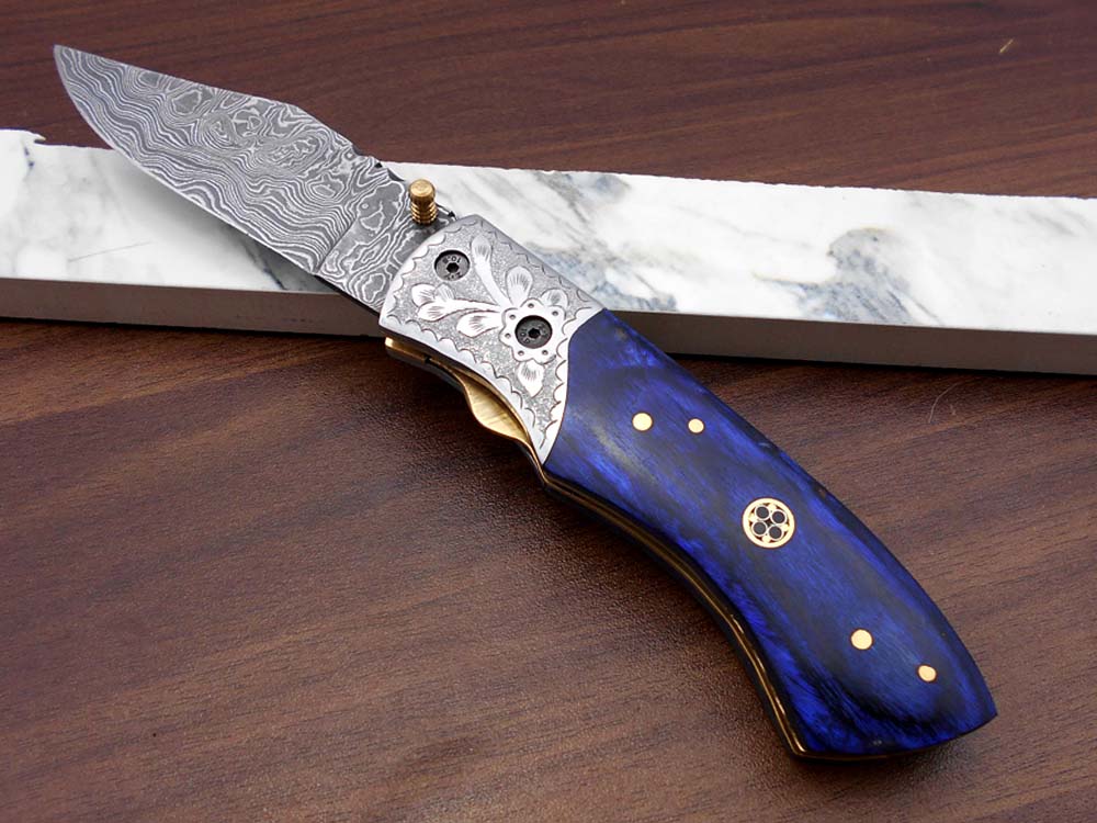 8" long hand forged custom made Damascus steel pocket clip folding knife, Blue Colored wood scale with engraved steel Bolster, Cow hide leather sheath included
