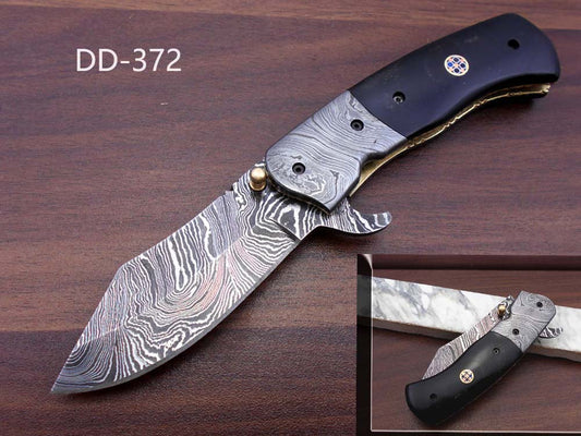 7.25" Folding Knife, 3.25" Hand Forged Twist Pattern Damascus Steel Blade, Black G-10 Scales, Pocket Knife, Liner Lock & Thumb knob Equipped, Cow Hide Leather Sheath