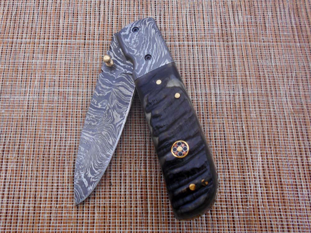 7.75" Damascus steel folding knife, liner lock, thumb knob, Cow sheath