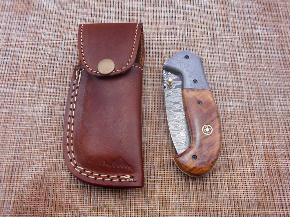 Hand forged twist pattern Damascus steel 7.5" folding knife, Available in 3 scales options with Bolster, Pocket knife Equipped with Brass liner lock & thumb knob, Cow Hide Leather sheath