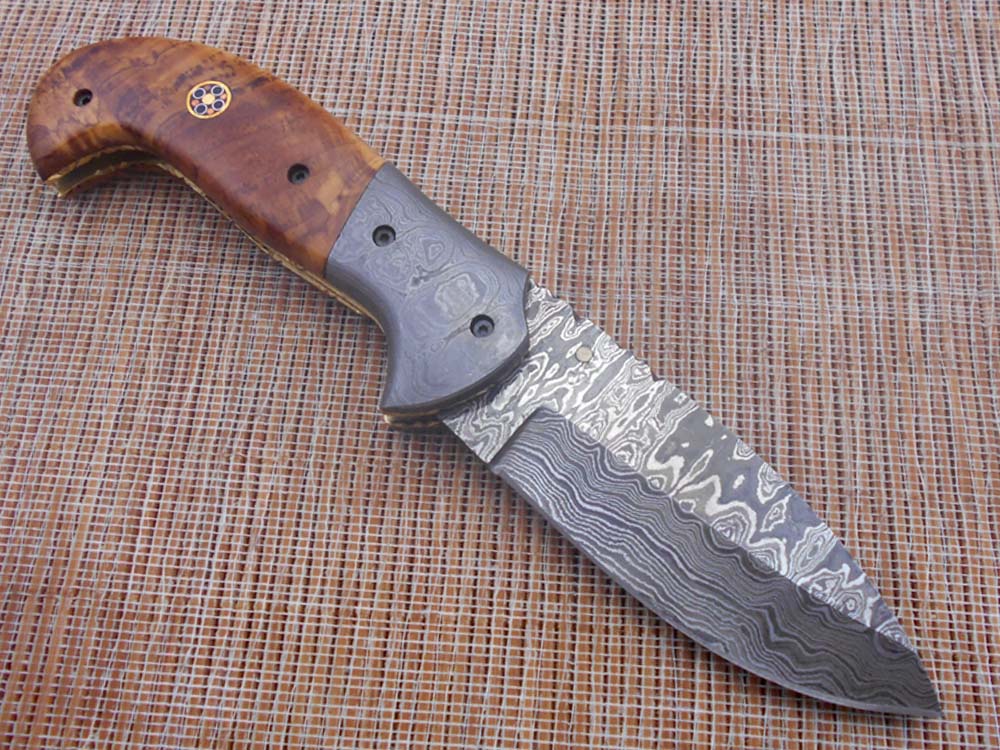 Hand forged twist pattern Damascus steel 7.5" folding knife, Available in 3 scales options with Bolster, Pocket knife Equipped with Brass liner lock & thumb knob, Cow Hide Leather sheath