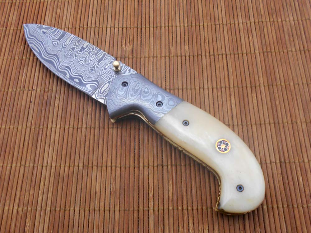 Hand forged twist pattern Damascus steel 7.5" folding knife, Available in 3 scales options with Bolster, Pocket knife Equipped with Brass liner lock & thumb knob, Cow Hide Leather sheath