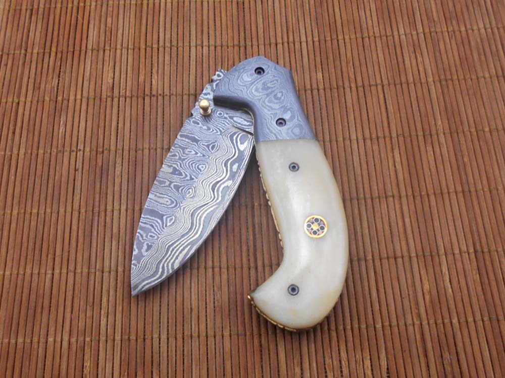 Hand forged twist pattern Damascus steel 7.5" folding knife, Available in 3 scales options with Bolster, Pocket knife Equipped with Brass liner lock & thumb knob, Cow Hide Leather sheath