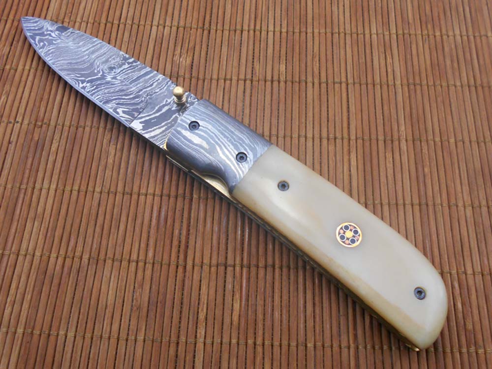 7.75" Damascus steel folding knife, liner lock, thumb knob, Cow sheath
