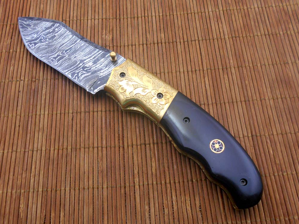 8" Damascus steel folding pocket knife with plant Engraved on brass bolster, White & black colors scale, included leather sheath