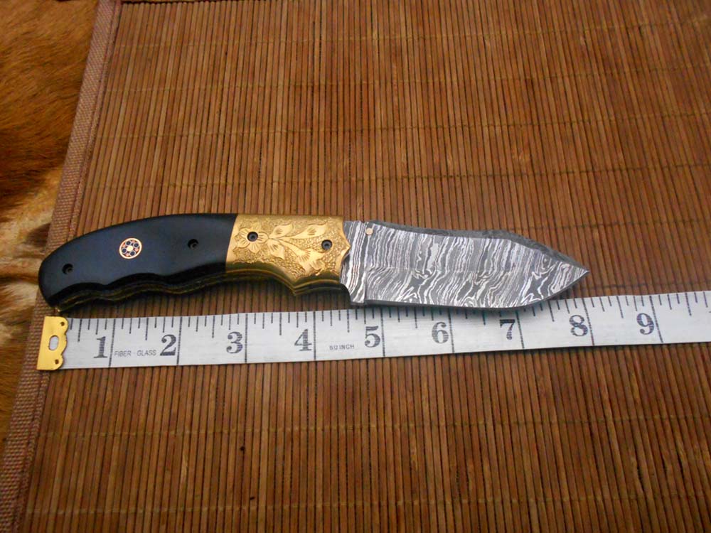 8" Damascus steel folding pocket knife with plant Engraved on brass bolster, White & black colors scale, included leather sheath