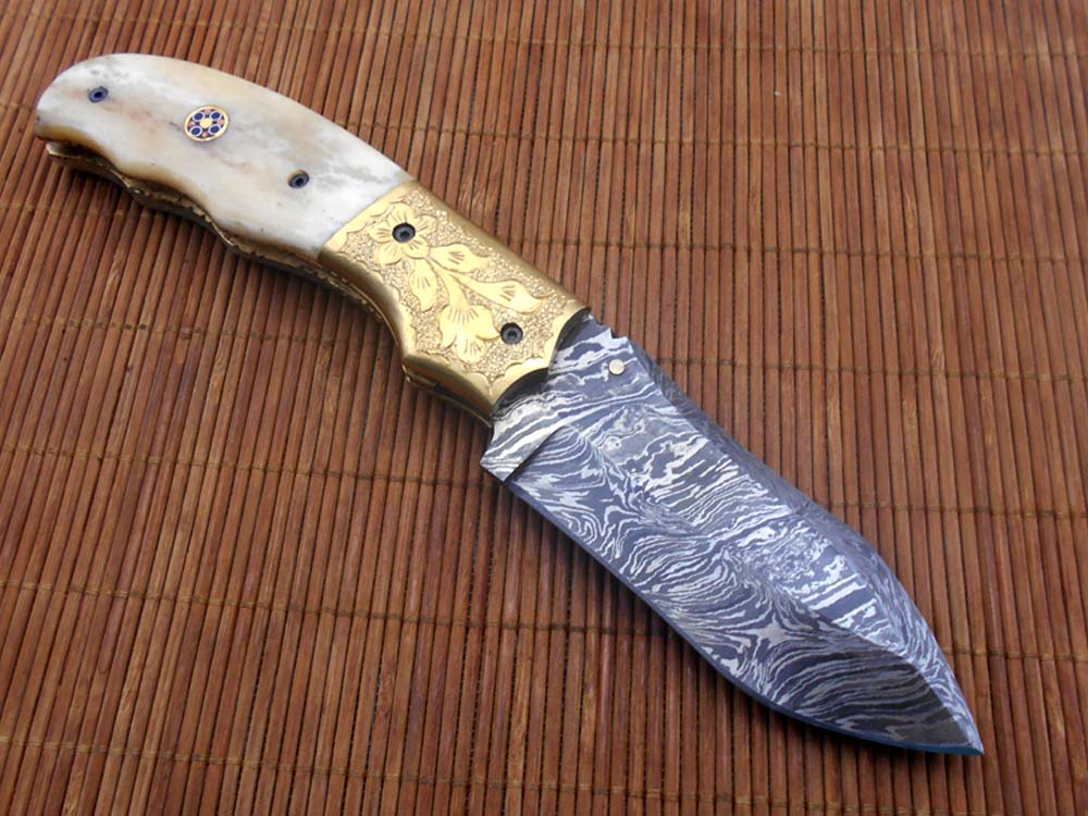 8" Damascus steel folding pocket knife with plant Engraved on brass bolster, White & black colors scale, included leather sheath