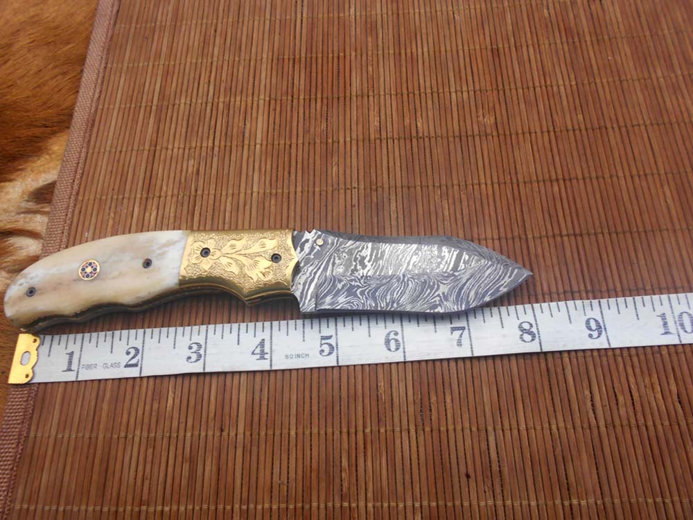 8" Damascus steel folding pocket knife with plant Engraved on brass bolster, White & black colors scale, included leather sheath