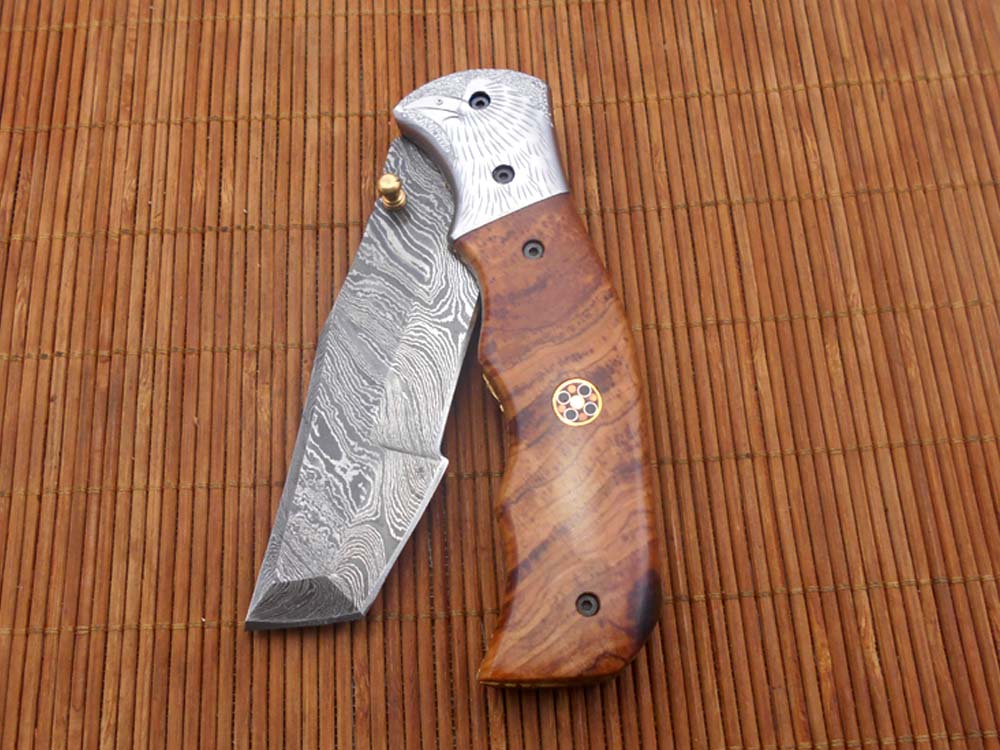 Folding knife Tracker blade knife with Engraved bird on steel bolster, 8" Hand forged Damascus steel, Available in 3 scales, Equipped with Brass Liner lock, Cow hide Leather sheath with belt loop