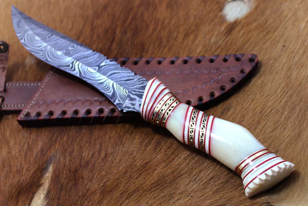 13" Long hand forged Damascus steel skinning knife, Hand carved scale crafted with engraved brass spacer, Available in Camel bone, Walnut wood and bull horn scales, Includes Cow Leather sheath